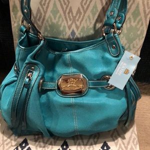 Kathy Van Zeeland blue bag with makeup purse